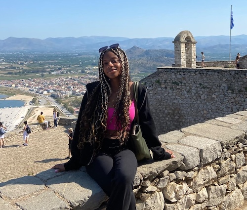 Iycis Smith in Greece with cobblestone background